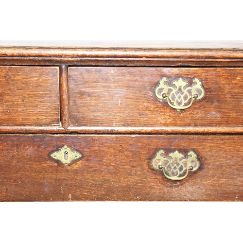 13 - A Georgian oak 2-over-3 oak chest of drawers with decorative brass fittings and bracket feet, approx... 