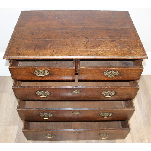 13 - A Georgian oak 2-over-3 oak chest of drawers with decorative brass fittings and bracket feet, approx... 