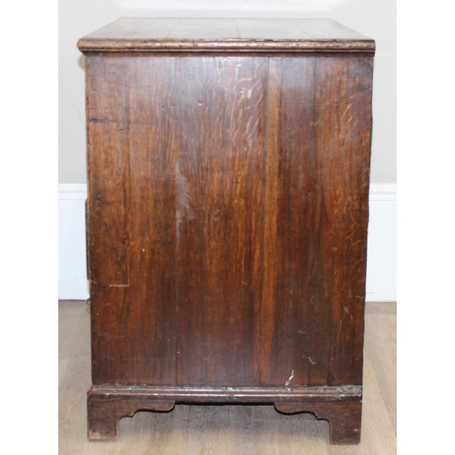 13 - A Georgian oak 2-over-3 oak chest of drawers with decorative brass fittings and bracket feet, approx... 