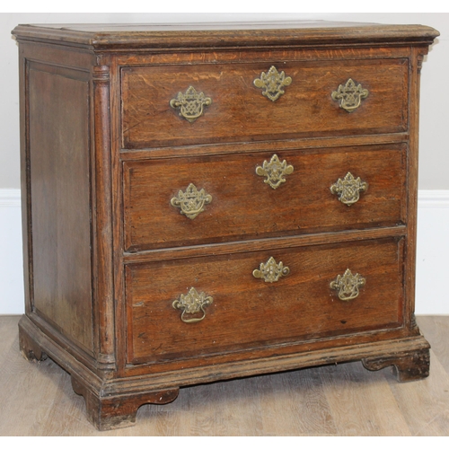 14 - A Georgian Oak chest of drawers with 3 drawers and bracket feet, the drawers with decorative brass f... 