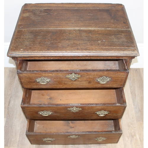 14 - A Georgian Oak chest of drawers with 3 drawers and bracket feet, the drawers with decorative brass f... 