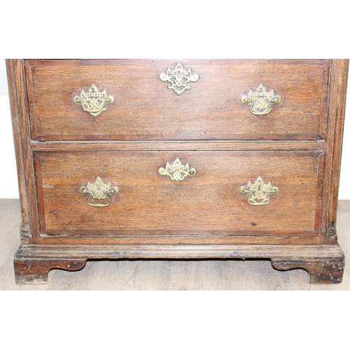 14 - A Georgian Oak chest of drawers with 3 drawers and bracket feet, the drawers with decorative brass f... 