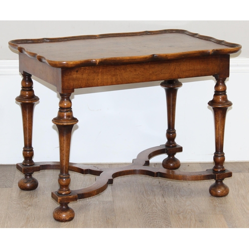 152 - A William & Mary style low table with quarter cut burr walnut veneer, X-form stretcher with piecrust... 