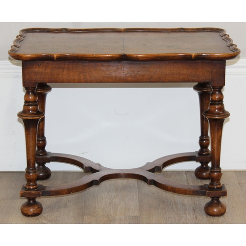 152 - A William & Mary style low table with quarter cut burr walnut veneer, X-form stretcher with piecrust... 