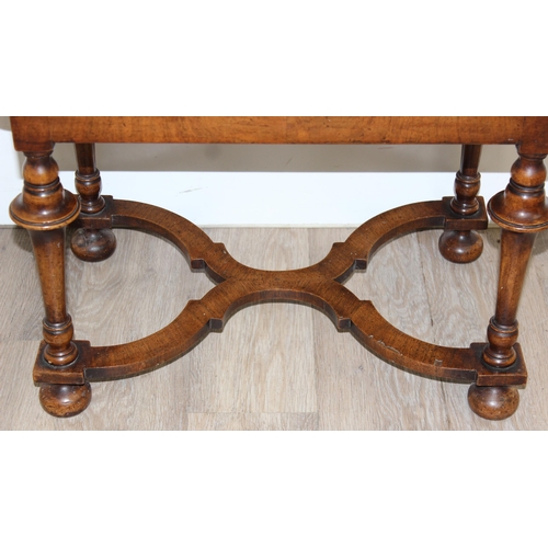 152 - A William & Mary style low table with quarter cut burr walnut veneer, X-form stretcher with piecrust... 