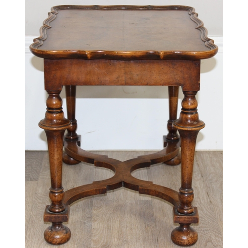 152 - A William & Mary style low table with quarter cut burr walnut veneer, X-form stretcher with piecrust... 