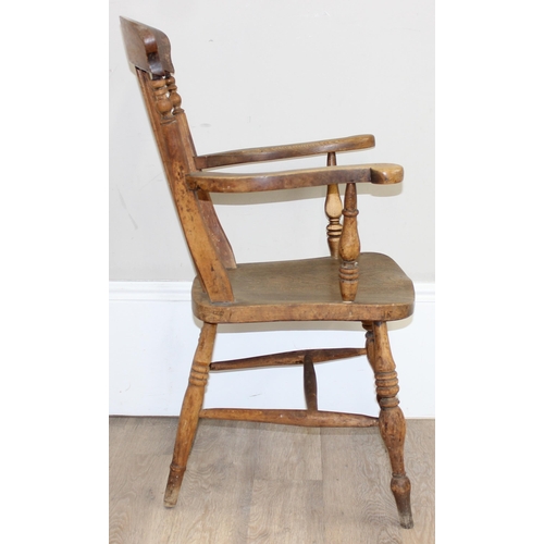 71 - An antique elm seated farmhouse Windsor armchair with stick back, approx 56cm wide x 100cm tall