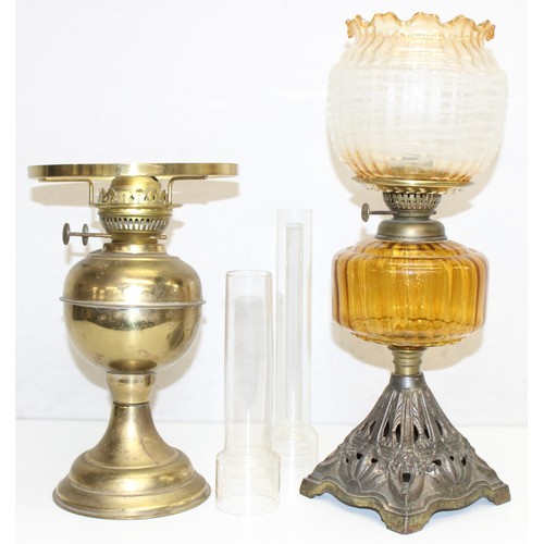 265 - 4 various oil lamps to include 2 with acid etched art nouveau glass shades, and 2 further spare glas... 