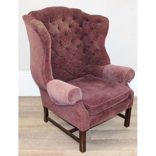 124 - A Georgian style wingback armchair with burgundy coloured button upholstery, approx 83cm wide x 115c... 