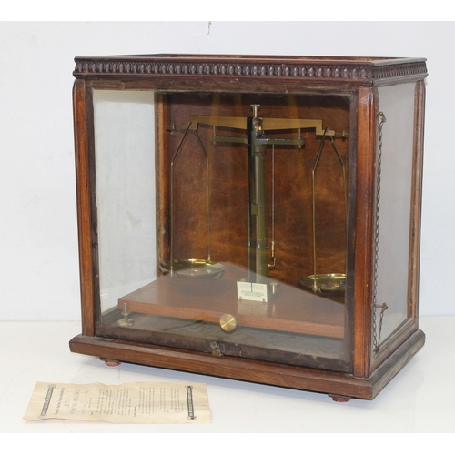 745 - Vintage scientific balance scales in glazed wooden case, approx 48cm x 27cm x 46cm and a surveyors l... 