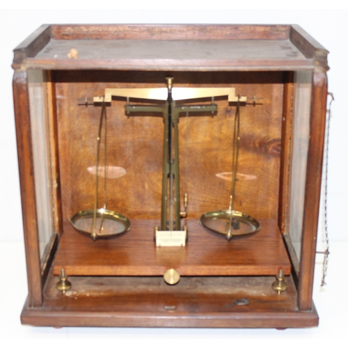 745 - Vintage scientific balance scales in glazed wooden case, approx 48cm x 27cm x 46cm and a surveyors l... 