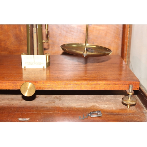 745 - Vintage scientific balance scales in glazed wooden case, approx 48cm x 27cm x 46cm and a surveyors l... 