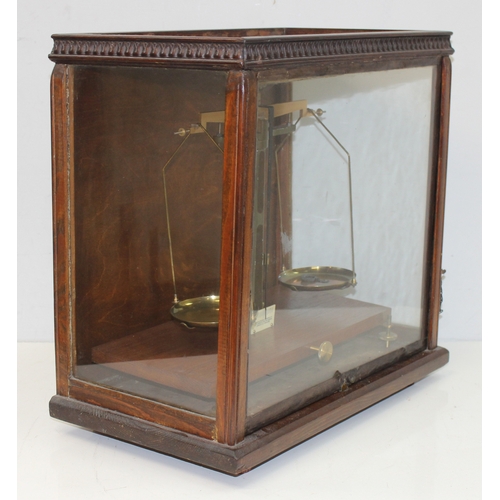 745 - Vintage scientific balance scales in glazed wooden case, approx 48cm x 27cm x 46cm and a surveyors l... 