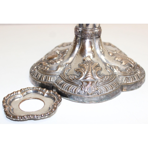 1066 - A pair of mid-18th century style silver plated candlesticks decorated with embossed acanthus scrolls... 