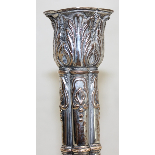 1066 - A pair of mid-18th century style silver plated candlesticks decorated with embossed acanthus scrolls... 