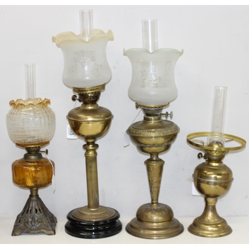 265 - 4 various oil lamps to include 2 with acid etched art nouveau glass shades, and 2 further spare glas... 