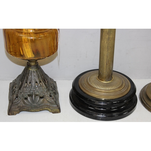 265 - 4 various oil lamps to include 2 with acid etched art nouveau glass shades, and 2 further spare glas... 