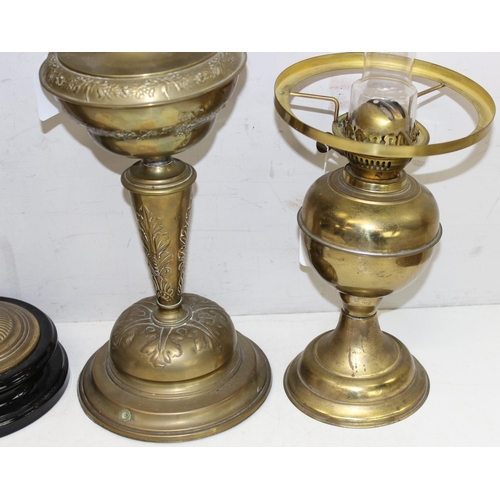 265 - 4 various oil lamps to include 2 with acid etched art nouveau glass shades, and 2 further spare glas... 