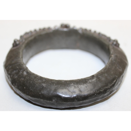 1132 - A pair of unusual ethnic bangles, possibly currency bangles, bronzed finish but XRF testing as appro... 