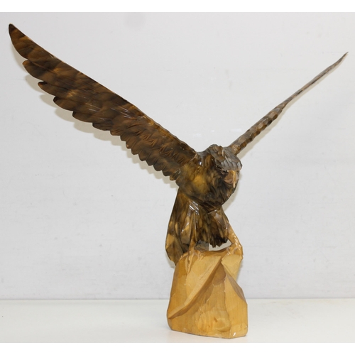 284 - Vintage chip carved wooden model of an eagle perched on a stump with detachable, approx 77cm W x 55c... 