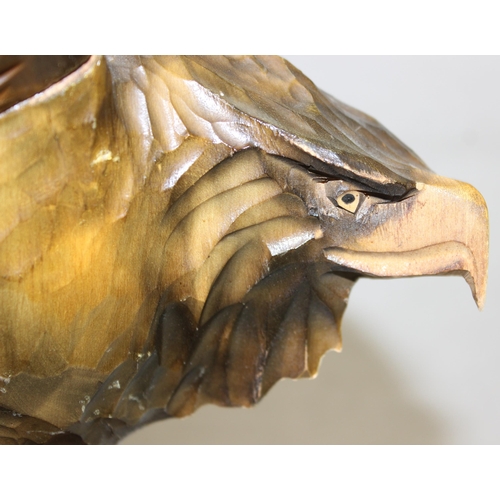 284 - Vintage chip carved wooden model of an eagle perched on a stump with detachable, approx 77cm W x 55c... 