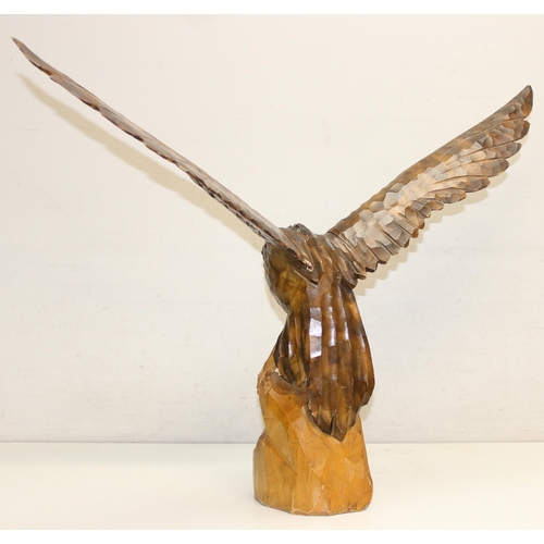 284 - Vintage chip carved wooden model of an eagle perched on a stump with detachable, approx 77cm W x 55c... 