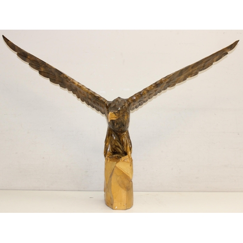 284 - Vintage chip carved wooden model of an eagle perched on a stump with detachable, approx 77cm W x 55c... 