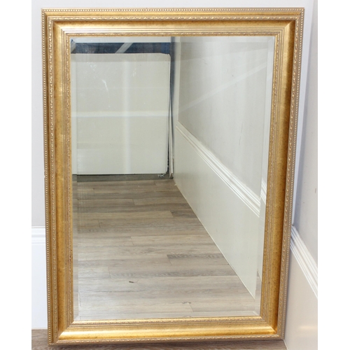 426 - Large gilt framed mirror with bevelled glass, approx size 104cm x 74cm