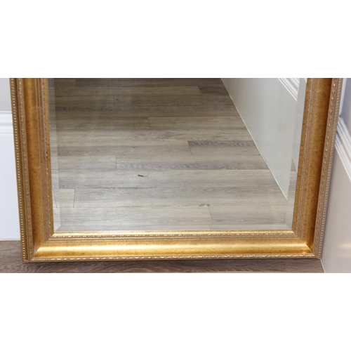 426 - Large gilt framed mirror with bevelled glass, approx size 104cm x 74cm