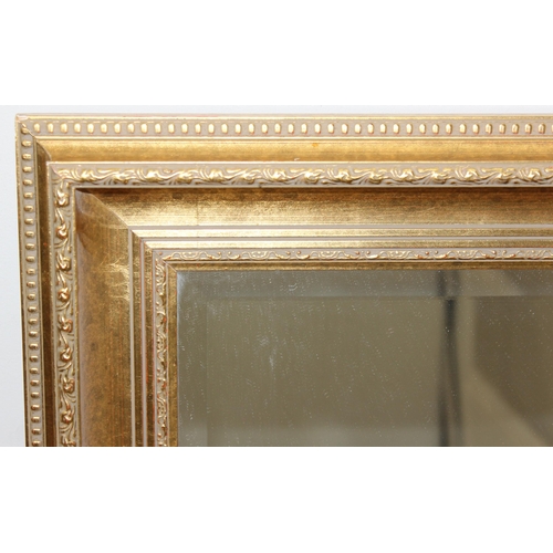 426 - Large gilt framed mirror with bevelled glass, approx size 104cm x 74cm