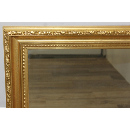 428 - Antique style gilt framed wall mirror, approx size 97cm x 73cm