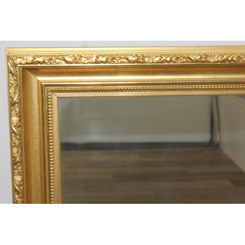 428 - Antique style gilt framed wall mirror, approx size 97cm x 73cm