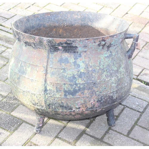 304 - A large cast iron cauldron with 3 legs and small angled handles, possibly by Coalbrookdale but seemi... 