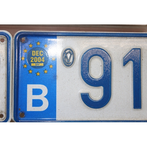 749 - Qty of vintage pressed aluminium car number plates to British and European examples, largest approx ... 