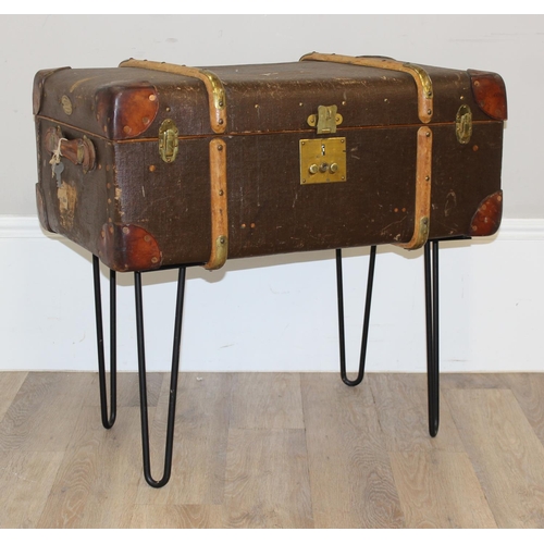 147 - A vintage canvas suitcase or shipping trunk coffee table on metal hairpin legs, approx 77cm wide x 4... 