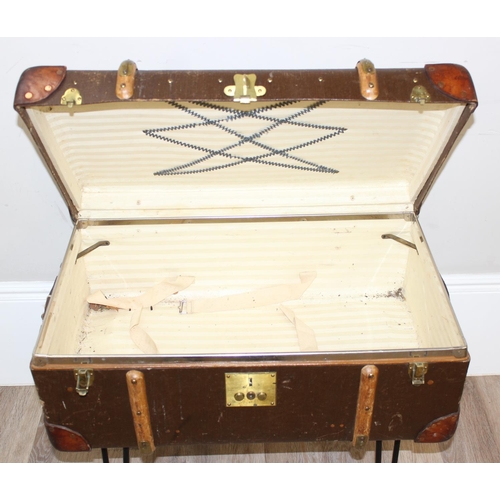 147 - A vintage canvas suitcase or shipping trunk coffee table on metal hairpin legs, approx 77cm wide x 4... 