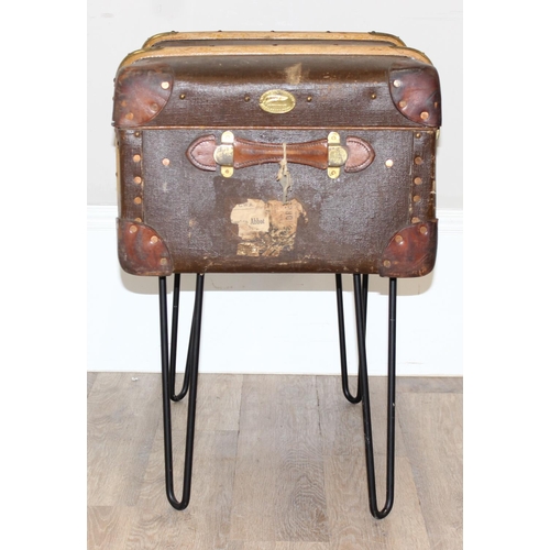 147 - A vintage canvas suitcase or shipping trunk coffee table on metal hairpin legs, approx 77cm wide x 4... 