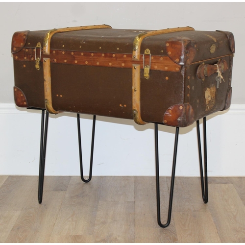 147 - A vintage canvas suitcase or shipping trunk coffee table on metal hairpin legs, approx 77cm wide x 4... 