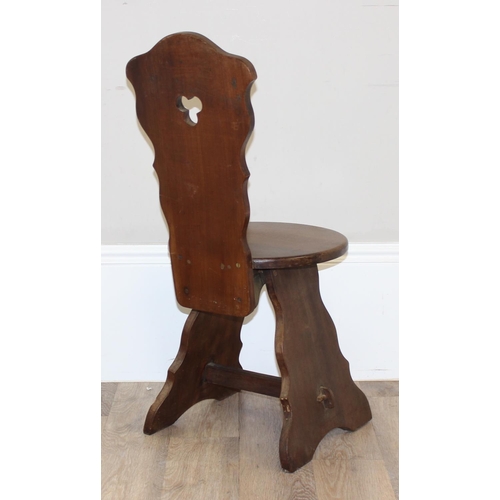 70 - A vintage mahogany hall chair with trefoil cut out to back and a round seat, approx 89cm tall