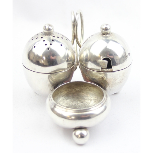 1003 - A silver cruet set of unusual form, Sheffield 1917 by Atkin Brothers, with associated silver salt sp... 