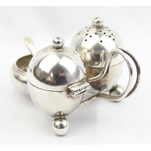 1003 - A silver cruet set of unusual form, Sheffield 1917 by Atkin Brothers, with associated silver salt sp... 