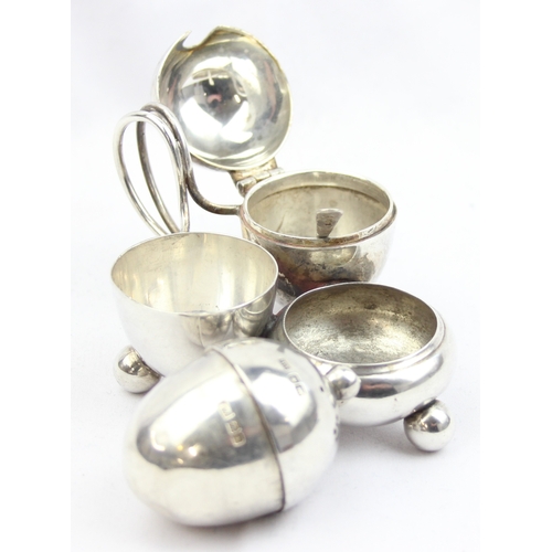 1003 - A silver cruet set of unusual form, Sheffield 1917 by Atkin Brothers, with associated silver salt sp... 