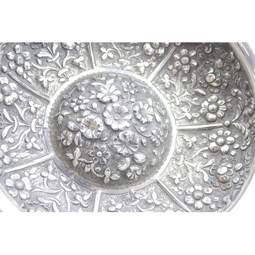 1009A - An impressive embossed Indian or middle eastern silver bowl with raised domed centre, decorated with... 