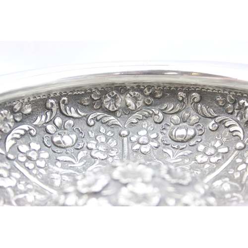 1009A - An impressive embossed Indian or middle eastern silver bowl with raised domed centre, decorated with... 