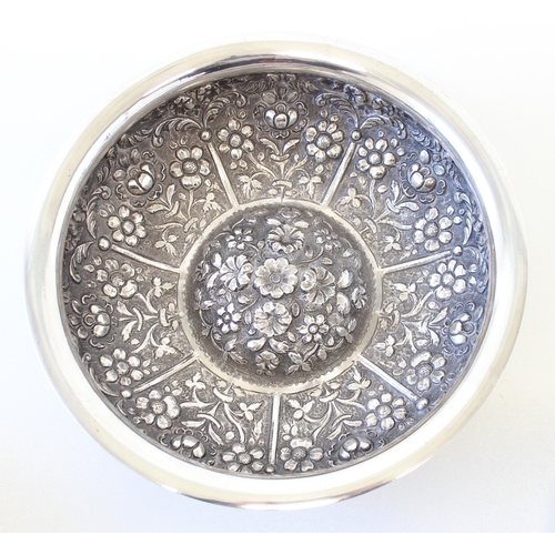 1009A - An impressive embossed Indian or middle eastern silver bowl with raised domed centre, decorated with... 