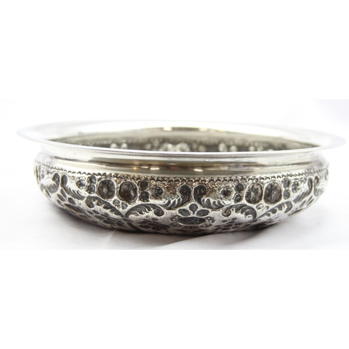 1009A - An impressive embossed Indian or middle eastern silver bowl with raised domed centre, decorated with... 