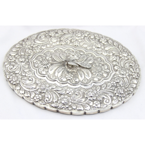 1009B - An impressive oval shaped silver backed hand mirror, likely Middle Eastern in origin, highly decorat... 