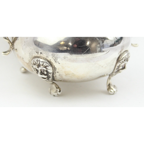 1009E - A vintage silver sugar bowl with frilled edges, lion mask and paw handles, marked Sterling and XRF c... 