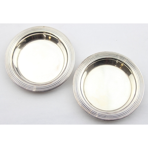 1009G - A pair of Christofle of France silver plated dishes or coasters, each approx 8cm in diameter, and 4 ... 