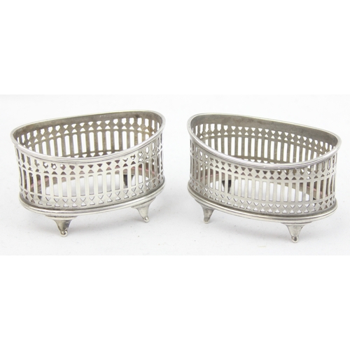 1014 - A pair of silver salts of Georgian style pierced boat shaped form, marked for Chester 1896 & 1898 by... 